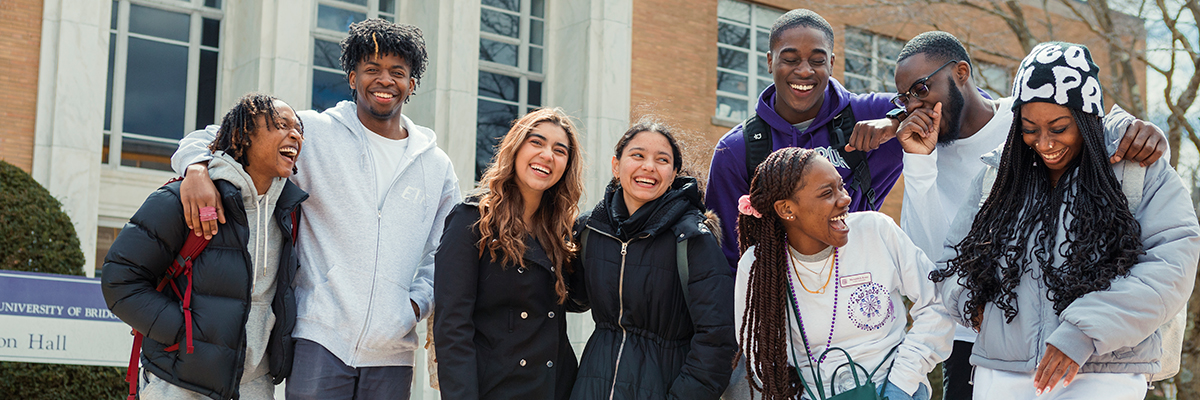 group of smiling and laughing UB students