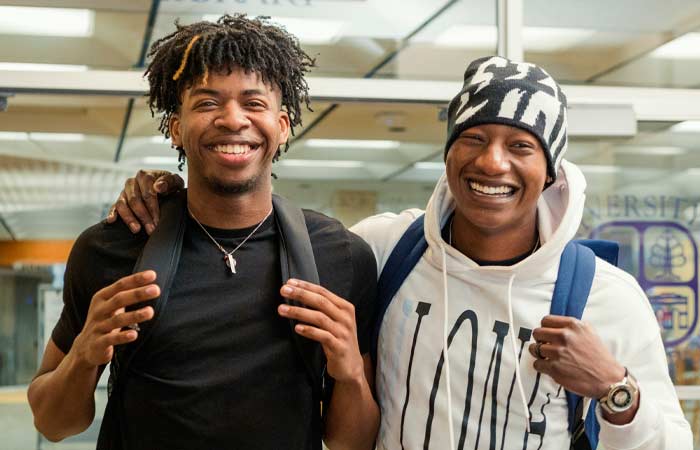 two smiling UB Students