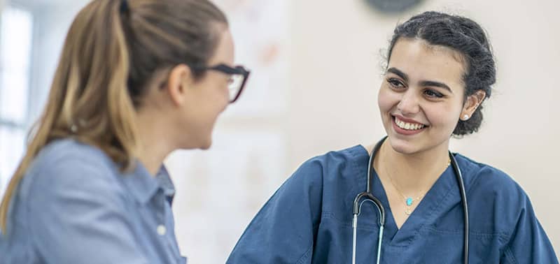 two nursing students talking